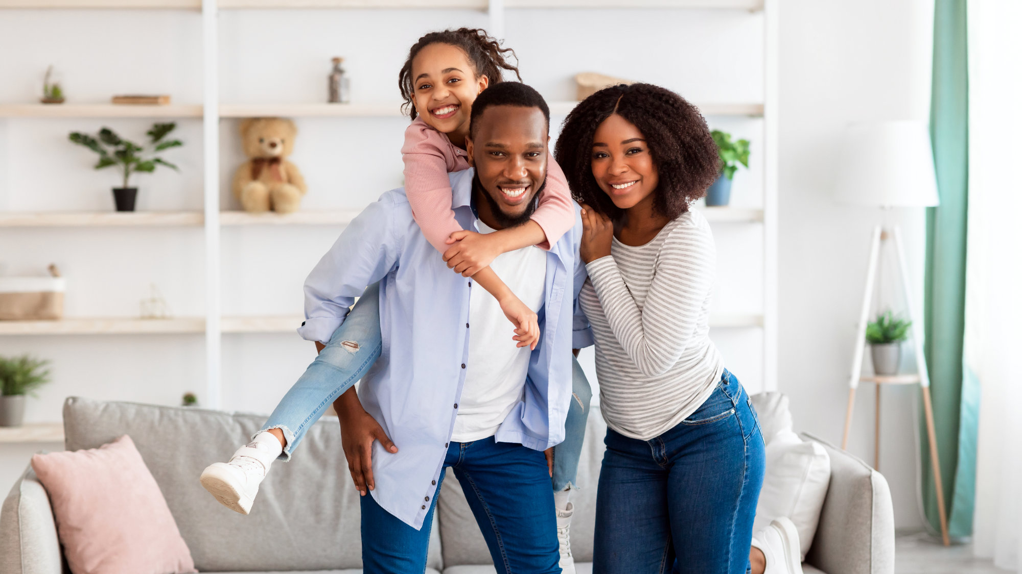 Portrait of a happy black family spending time at home that is heated and cooled by Echo.